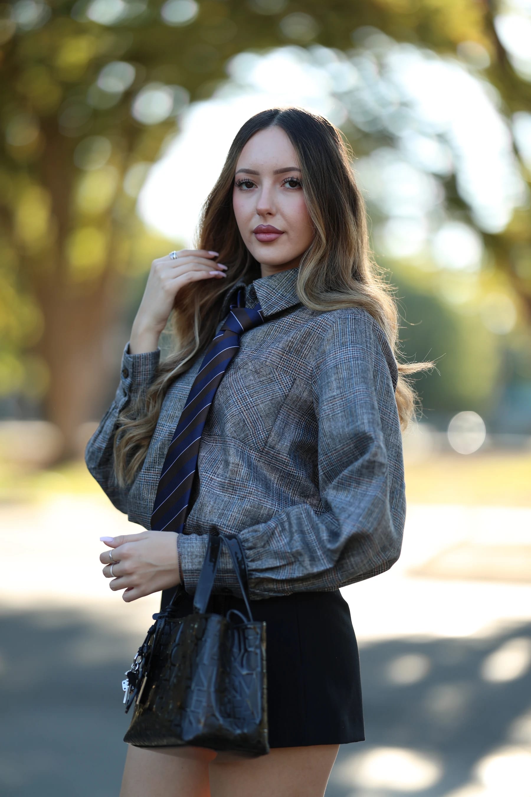 Andrea half body in backlight on the tree-lined road — photo B