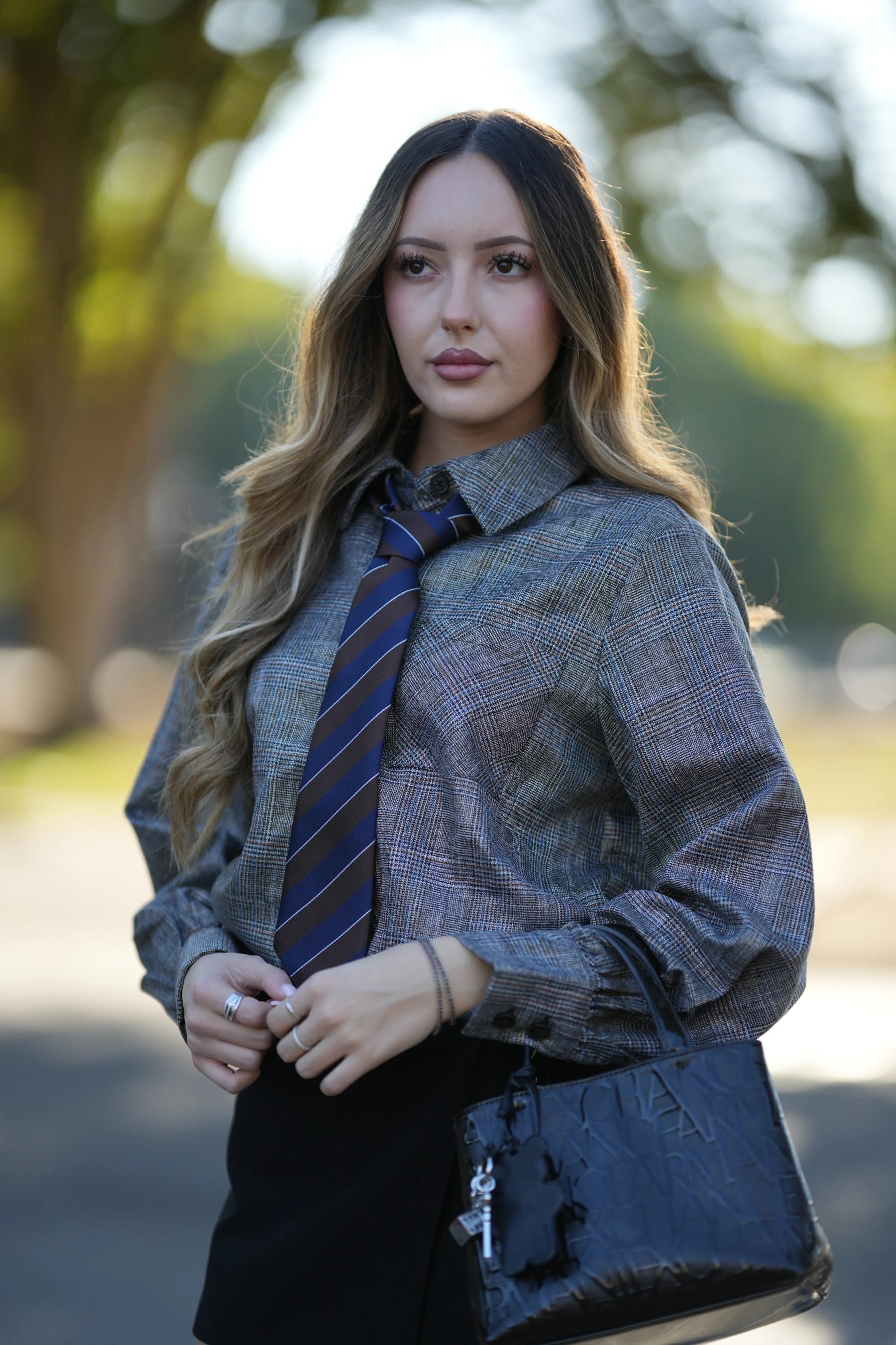 Andrea half body in backlight on the tree-lined road — photo A