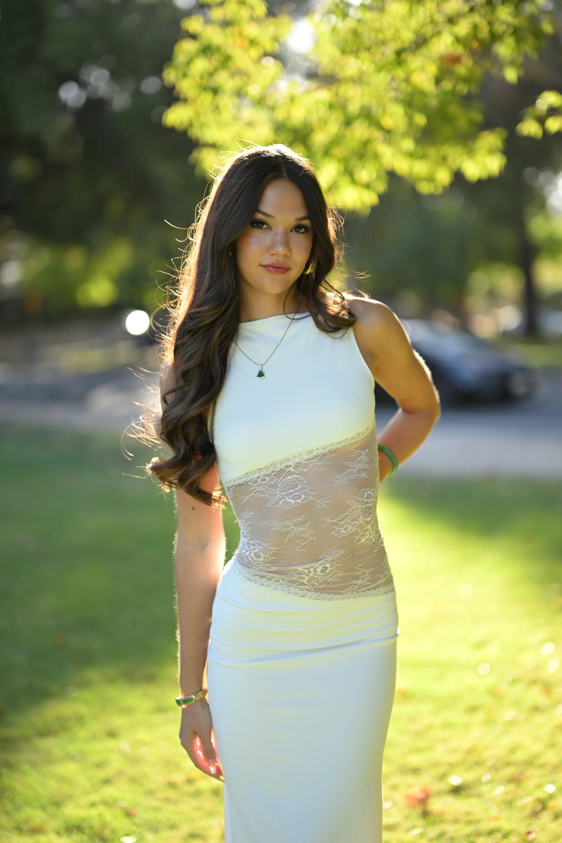 Mia half body, backlit by the late afternoon sun — photo A