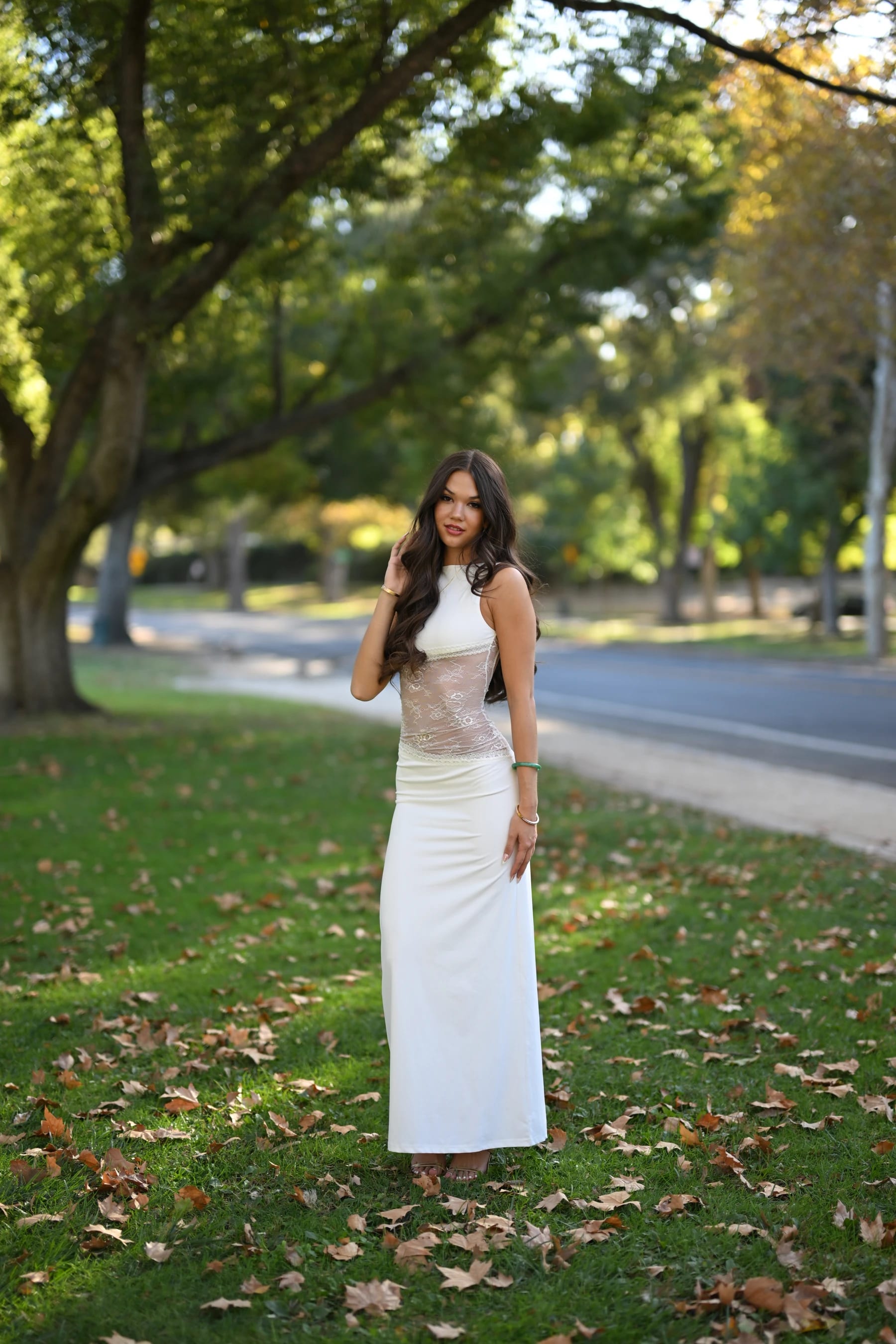 Mia full length under big oak trees — photo A