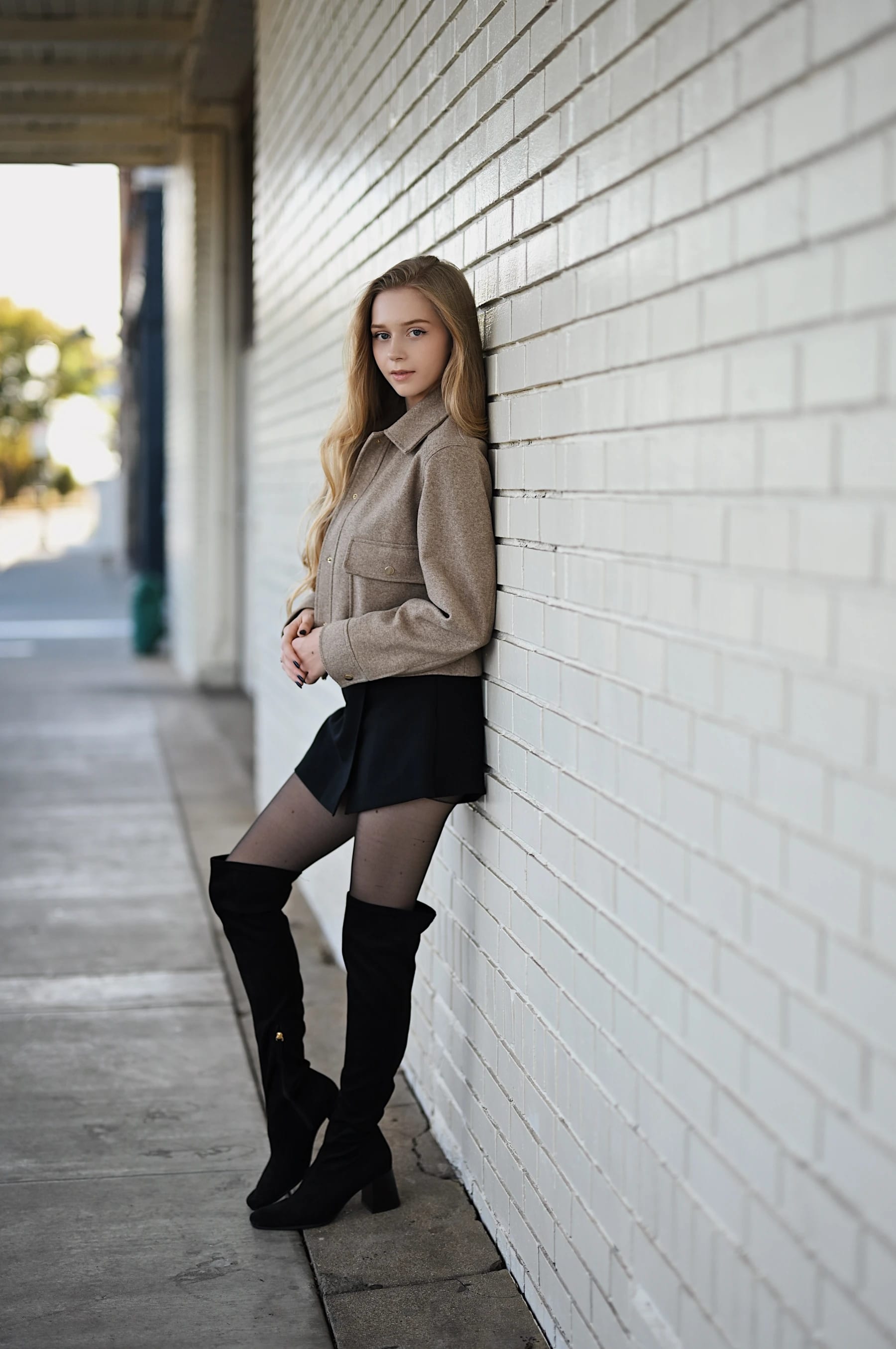 Sofia white brick wall portraits with leading lines, Nikkor Z 50mm f/1.2 S 1 of 7