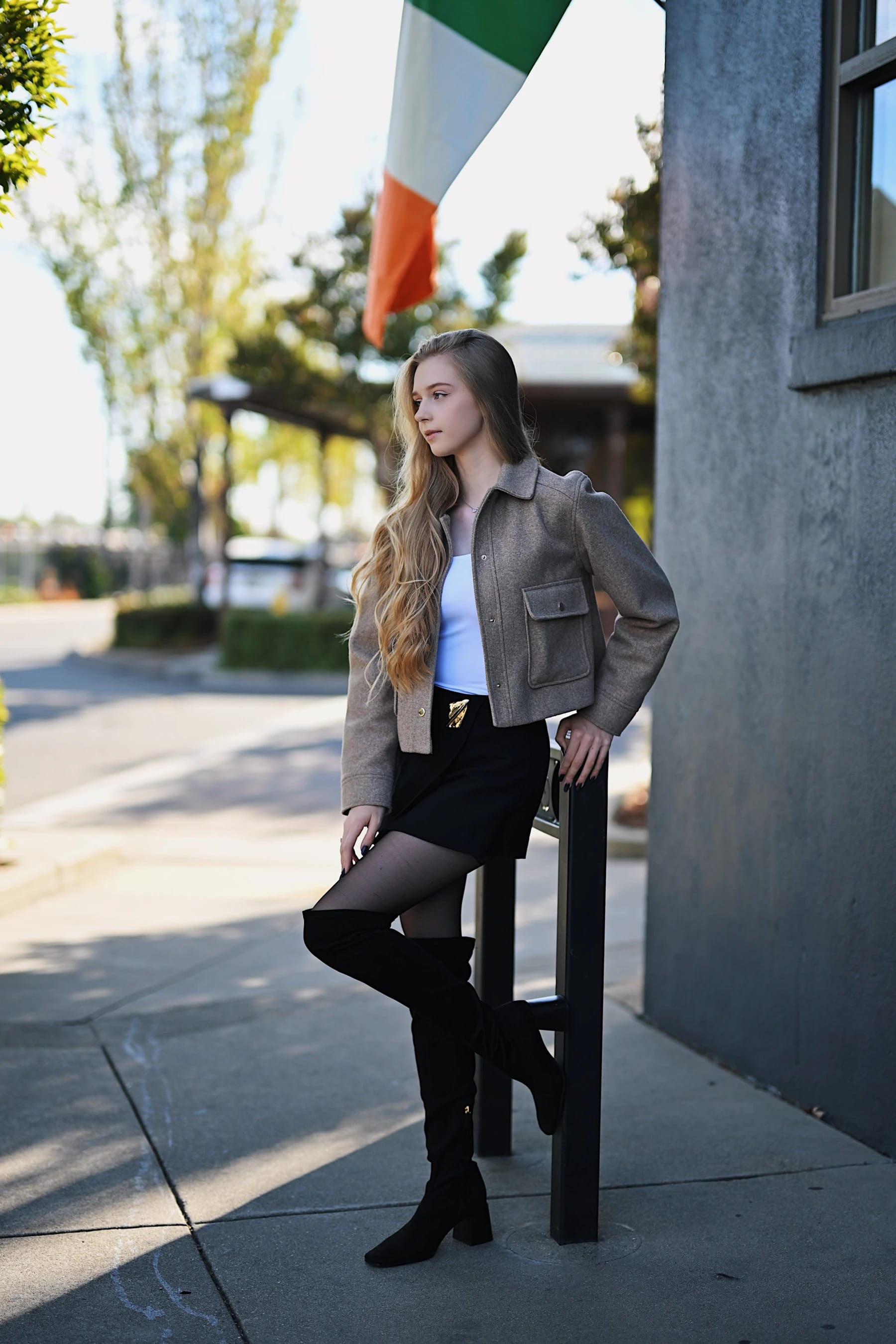 Sofia portraits against the grey wall of an Irish pub in Roseville 1 of 17