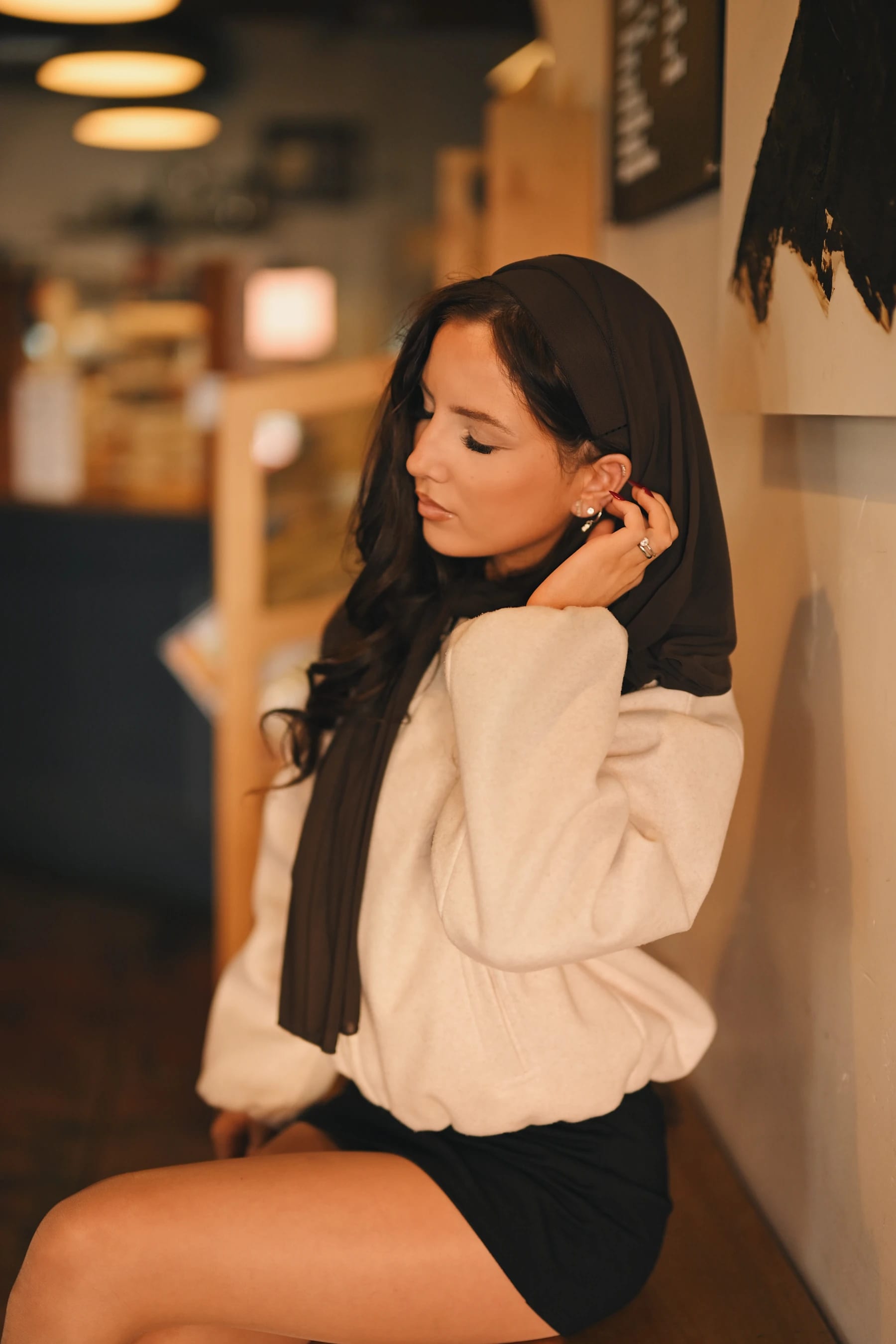 Yasmina inside Fourscore Coffee, warm indoor portraits, Nikon Z6III Nikkor Z 50mm f/1.2 S 1 of 2