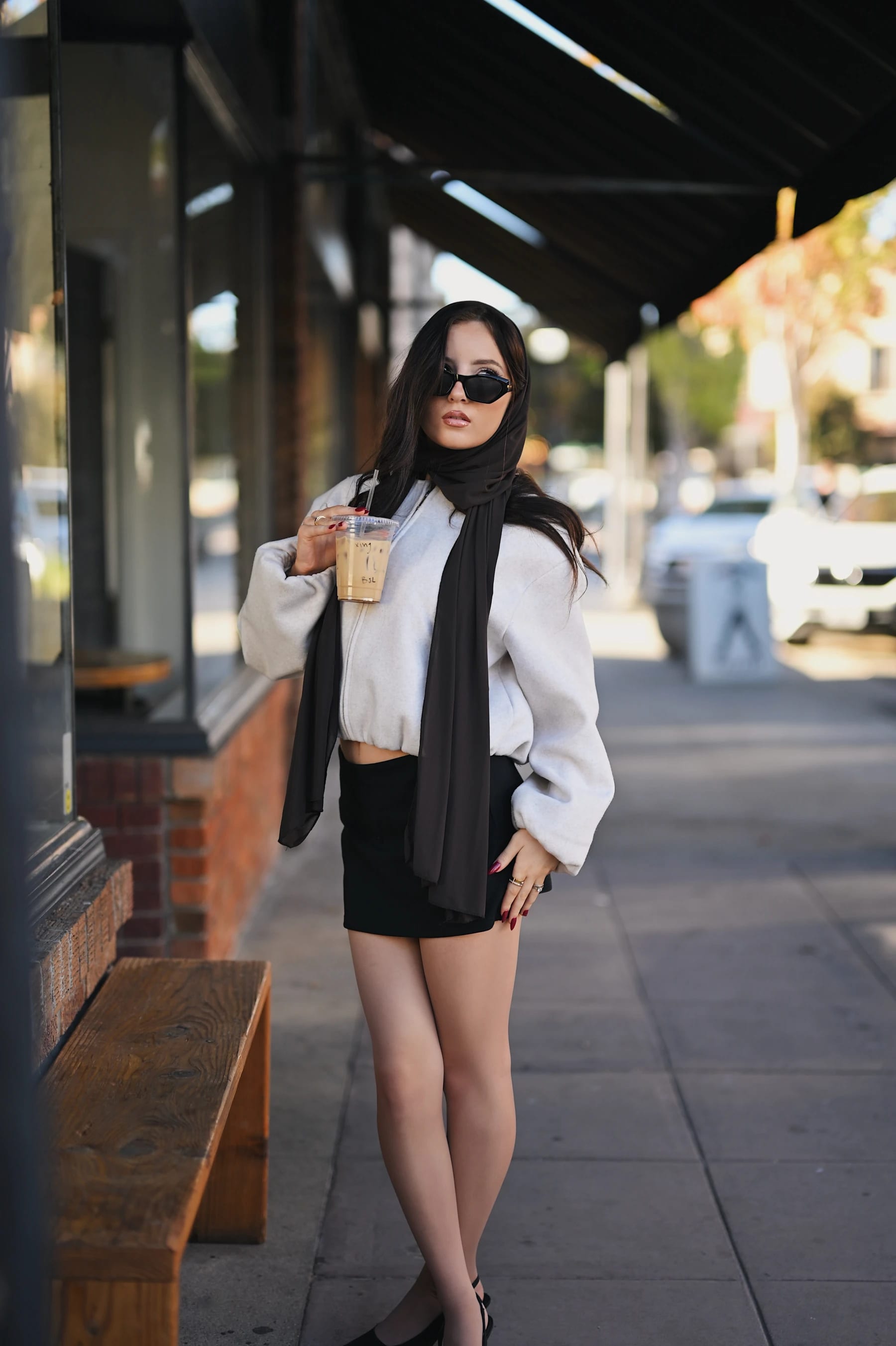 Yasmina standing poses outside Fourscore Coffee, Nikon Z6III Nikkor Z 50mm f/1.2 S 1 of 4