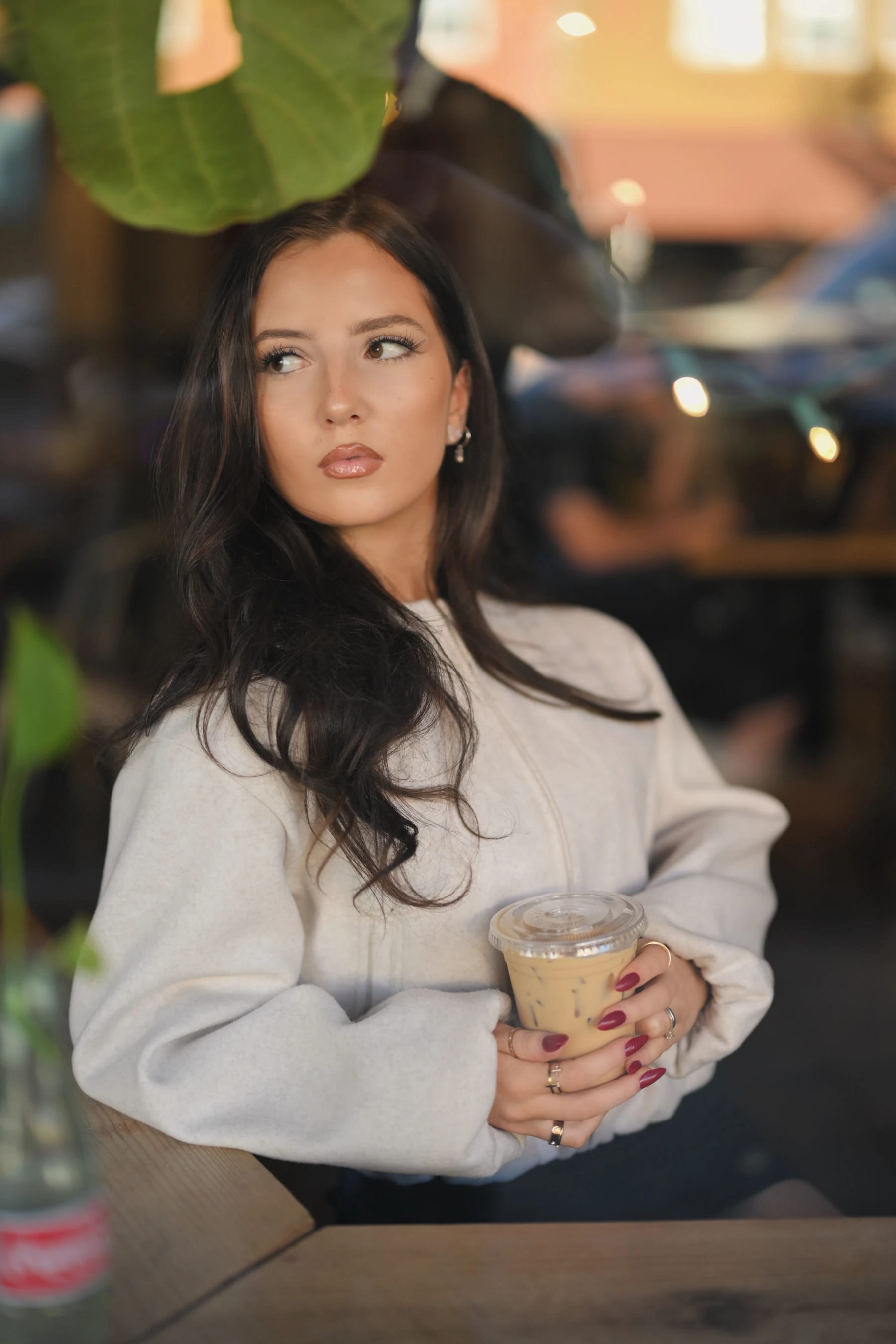 Yasmina through-the-window coffee shop portraits at Fourscore Coffee, Nikon Z6III Nikkor Z 50mm f/1.2 S 1 of 5