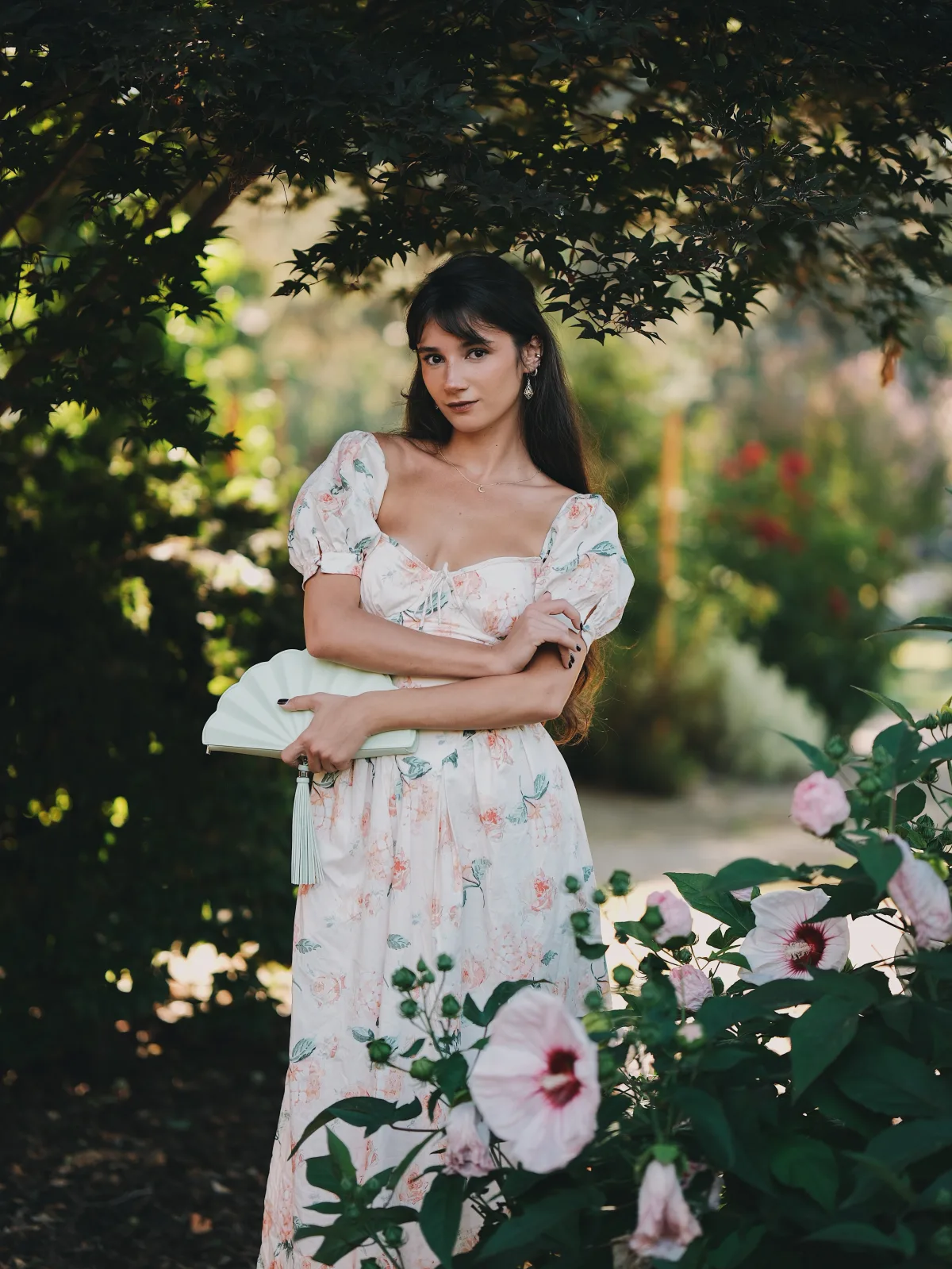 Rosina in shaded canopy with hibiscus, Fujifilm X-H2 XF 56mm f/1.2 1 of 3