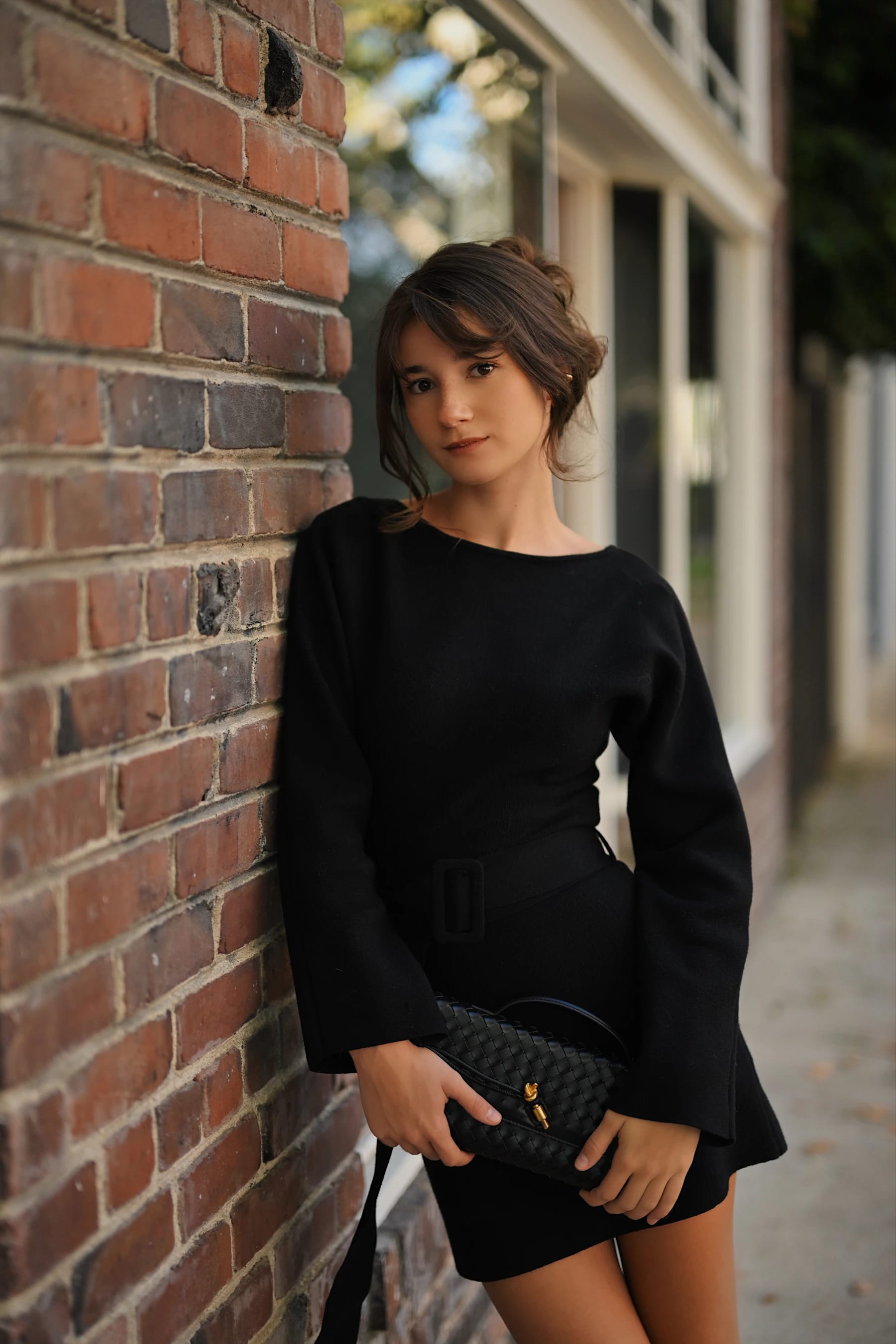 Rosina portraits against red brick walls, a red door entryway and storefront windows in Midtown Sacramento 1 of 31
