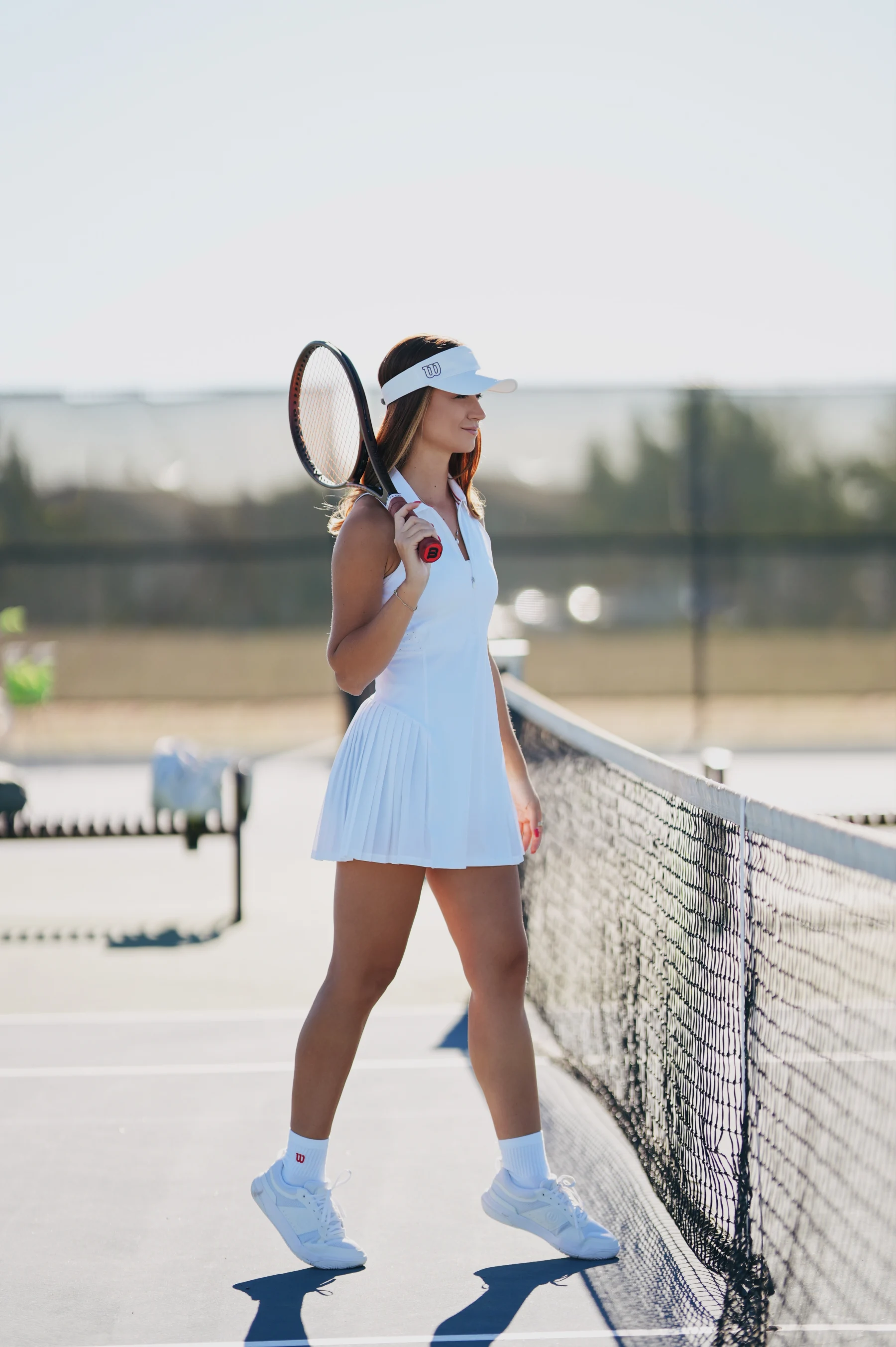 Natalia in white Wilson tennis outfit, visor and racket details, Sony A7IV 1 of 6