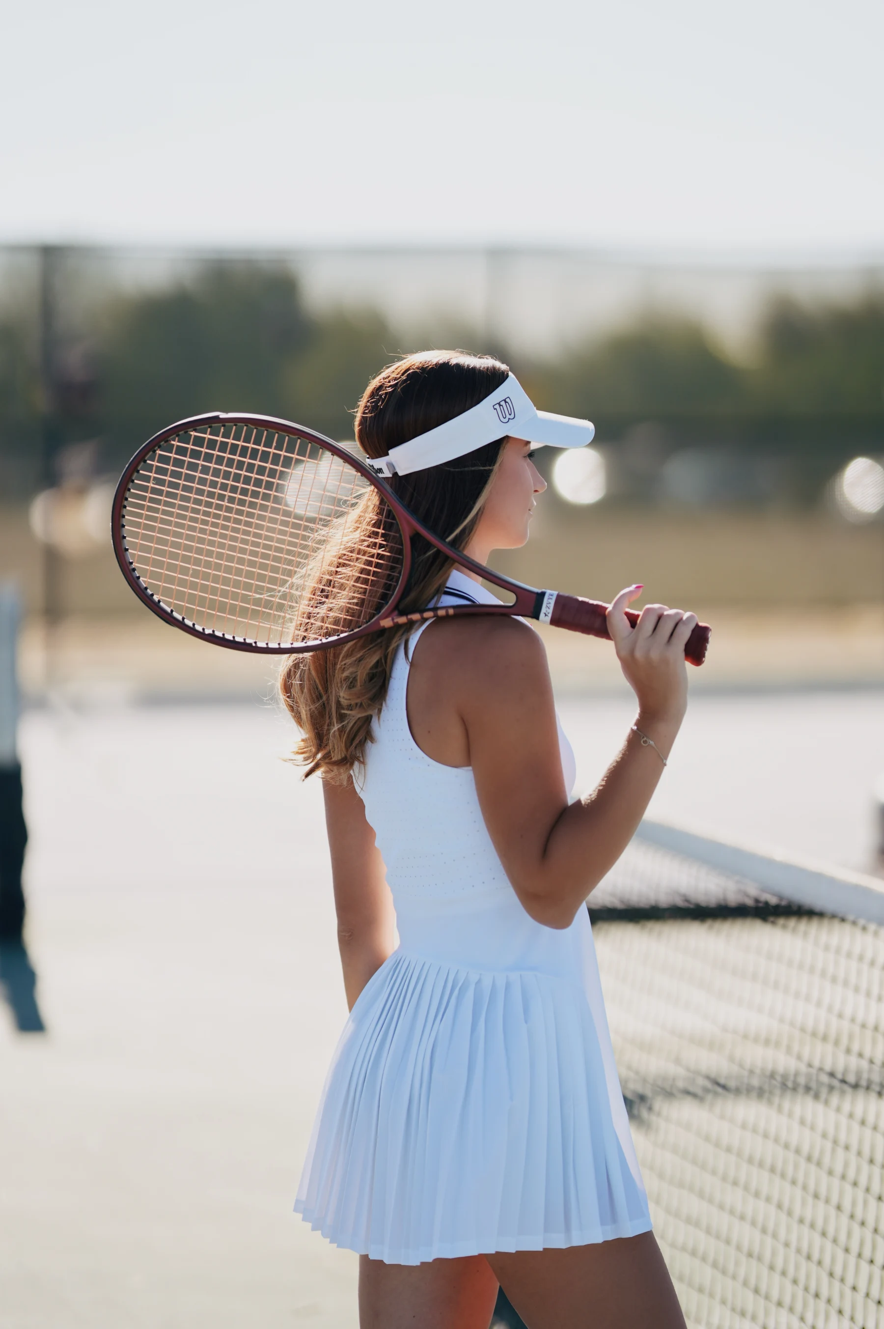 Natalia in a white Wilson tennis dress, courtside portraits, Sony A7IV Sigma 105mm F1.4 1 of 6