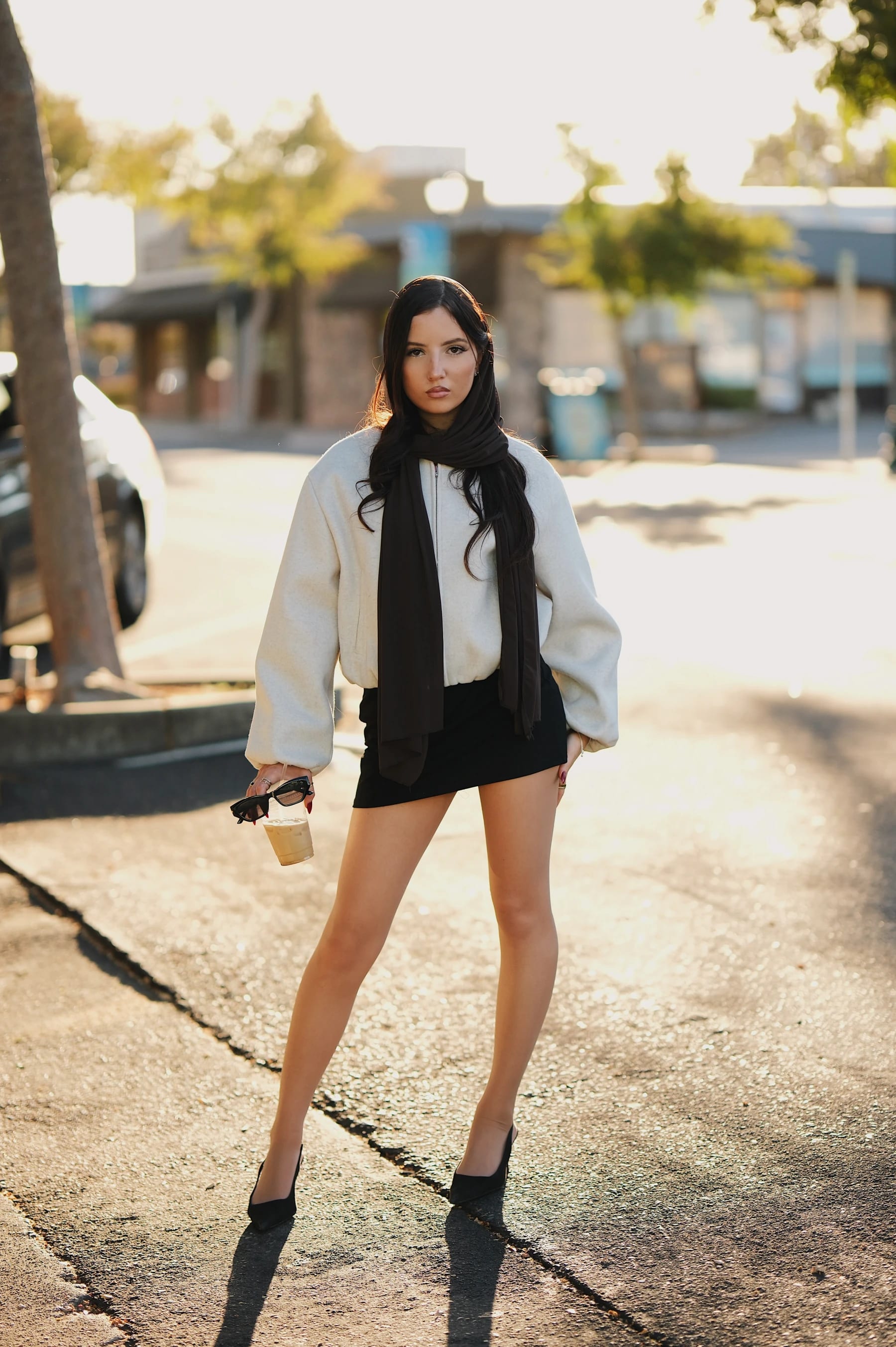 Yasmina full-length backlit street portraits facing the sun, Fujifilm X-H2 XF 56mm f/1.2 R WR 1 of 2
