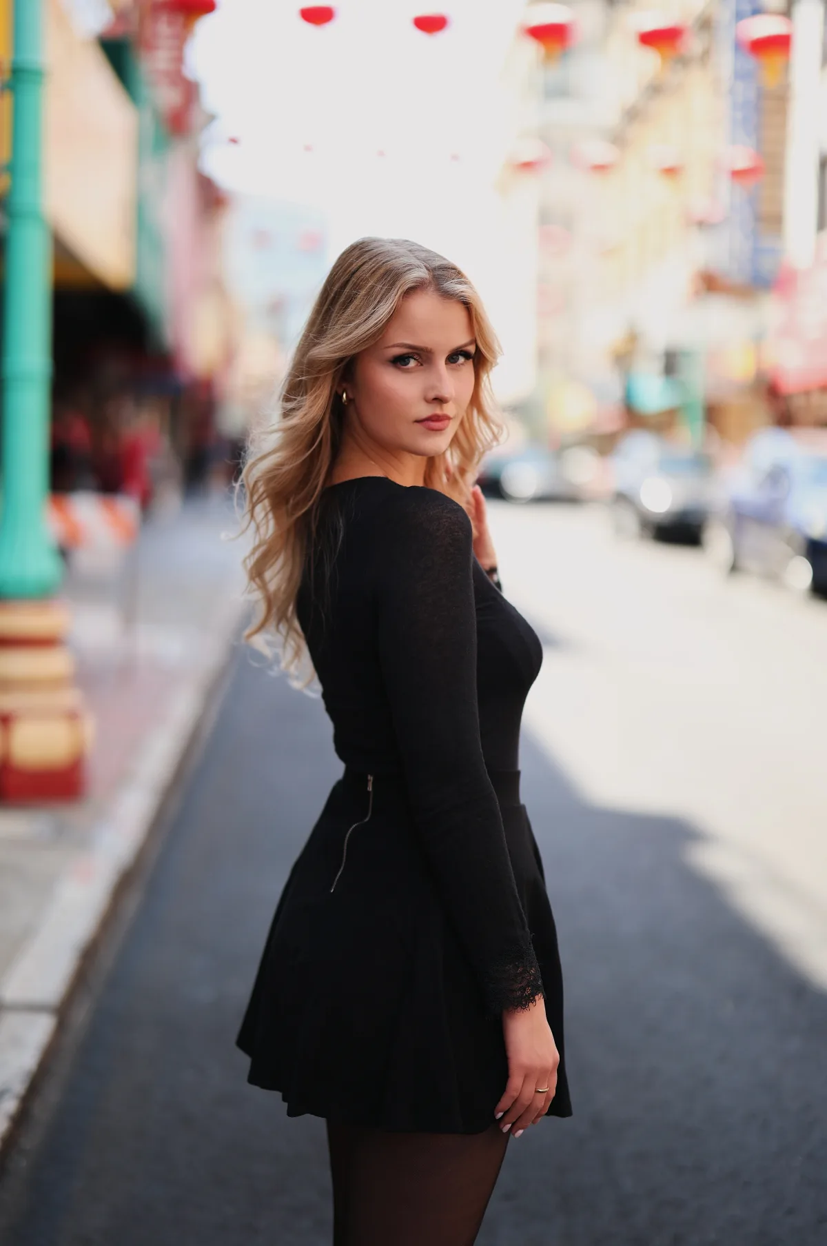 Canon RF 50mm f/1.2 L portrait, red lanterns overhead, Model: @anna.vsz