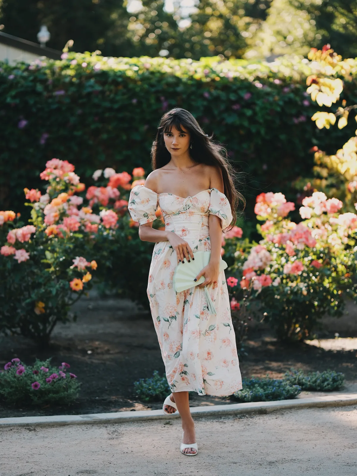 Rosina in front of coral roses, Classic Chrome