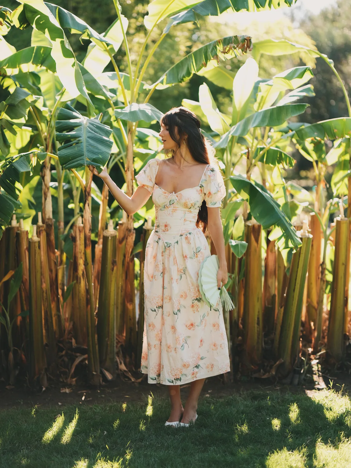 Rosina among banana palms in the garden