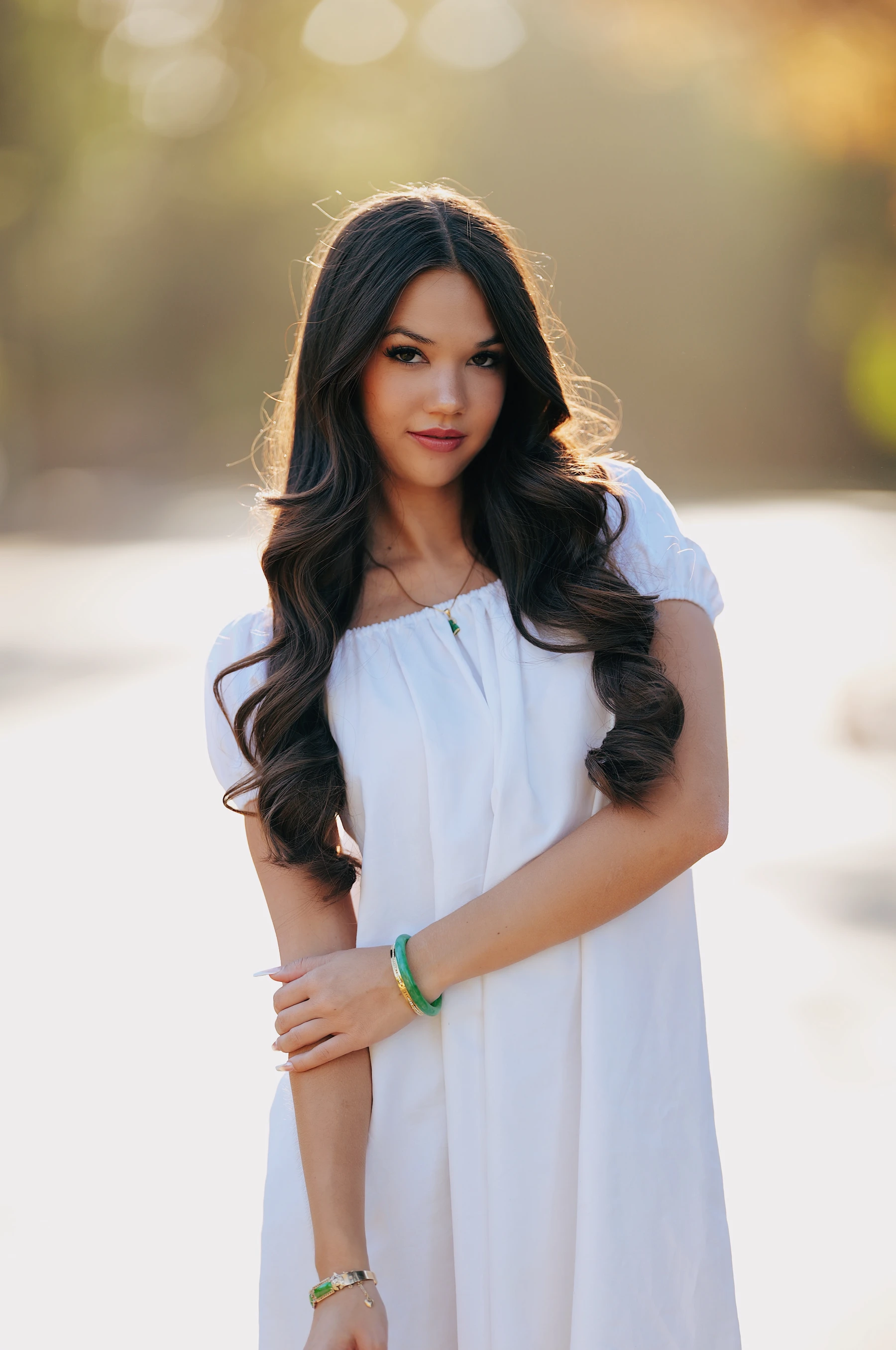 Mia half body in a white off-shoulder dress on a bright park road with yellow fall bokeh, Sigma 135mm F1.4 DG Art on Lumix S5II