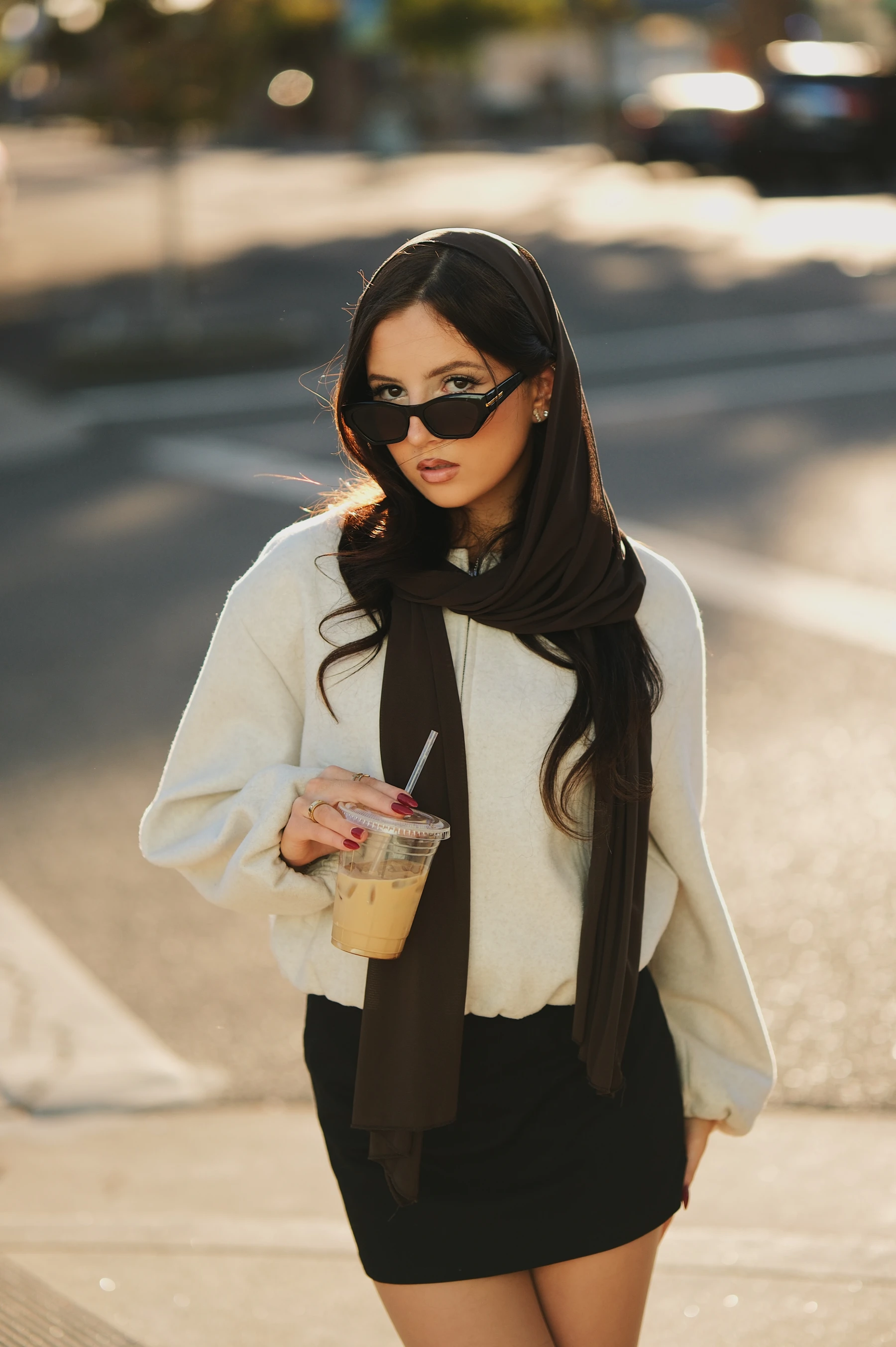 Yasmina lowering her sunglasses at a Roseville crosswalk, half-body portrait on the Fujifilm XF 56mm f/1.2 R WR
