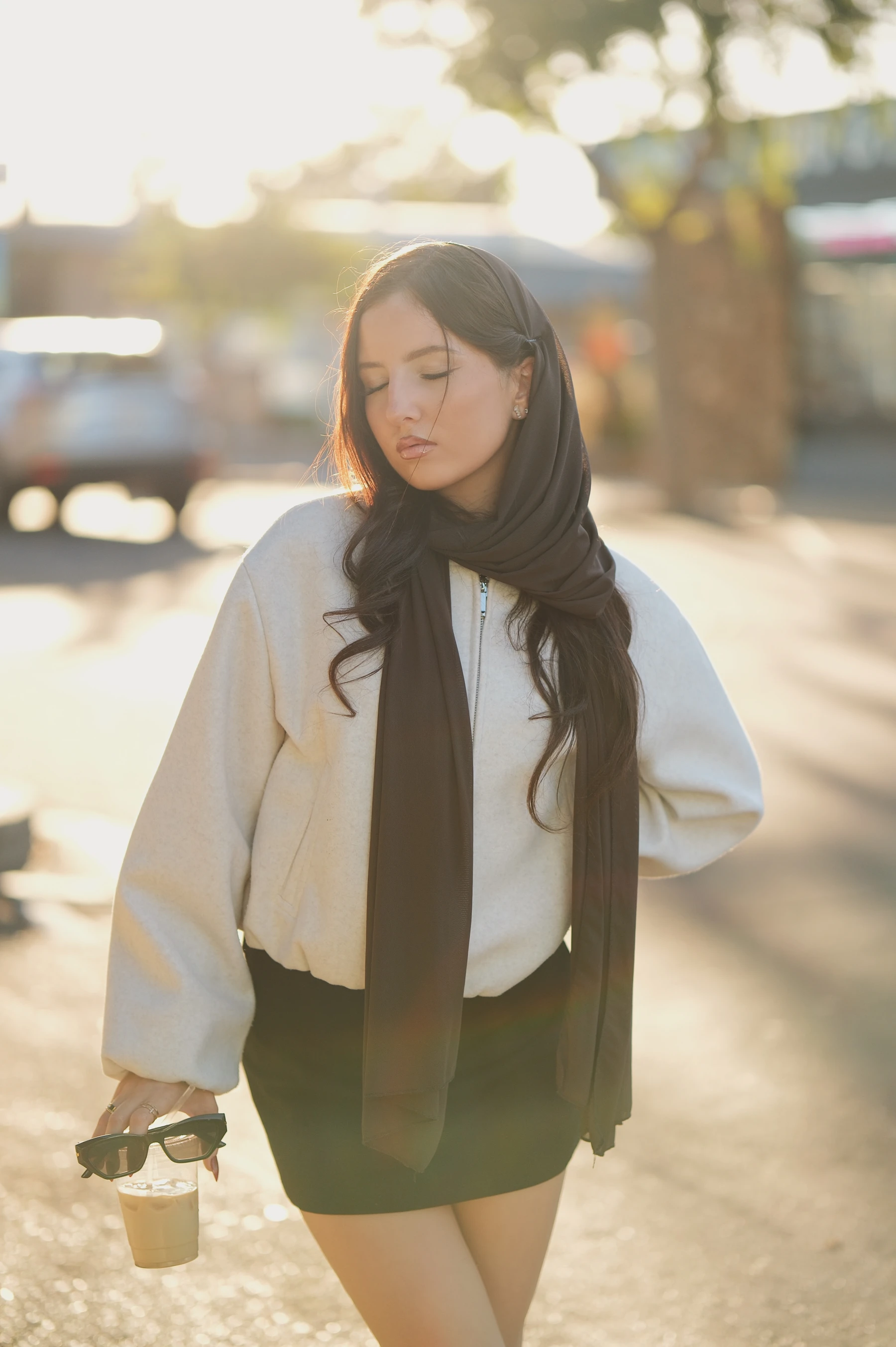 Yasmina with eyes closed and golden backlight through her hair, Fujifilm XF 56mm f/1.2 R WR into the sun